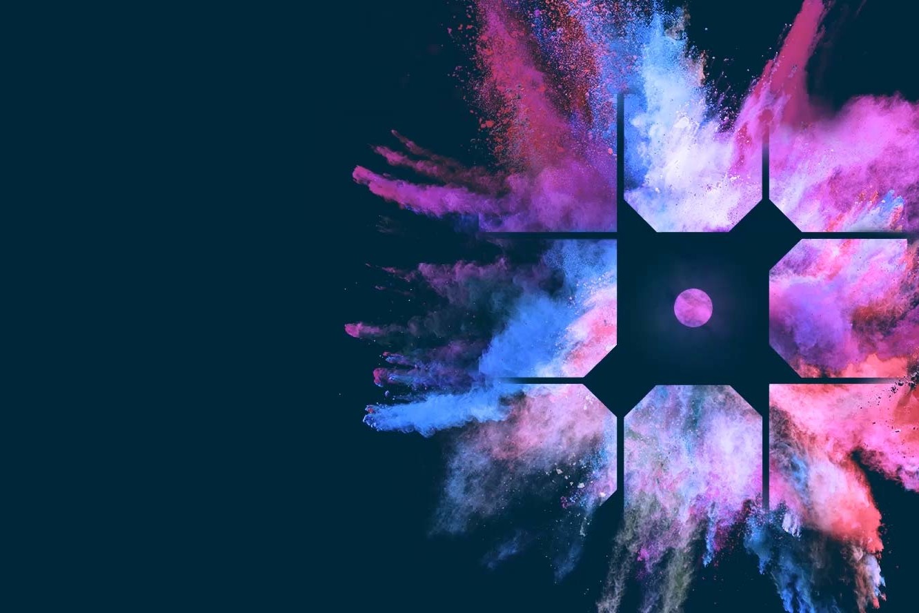pink and blue pigment dust exploding behind the WP Engine logo