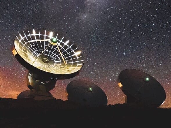 Giant Telescopes against a starry sky