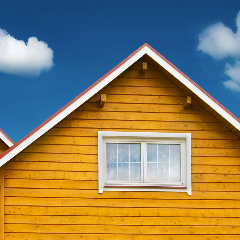 a small house against blue skies