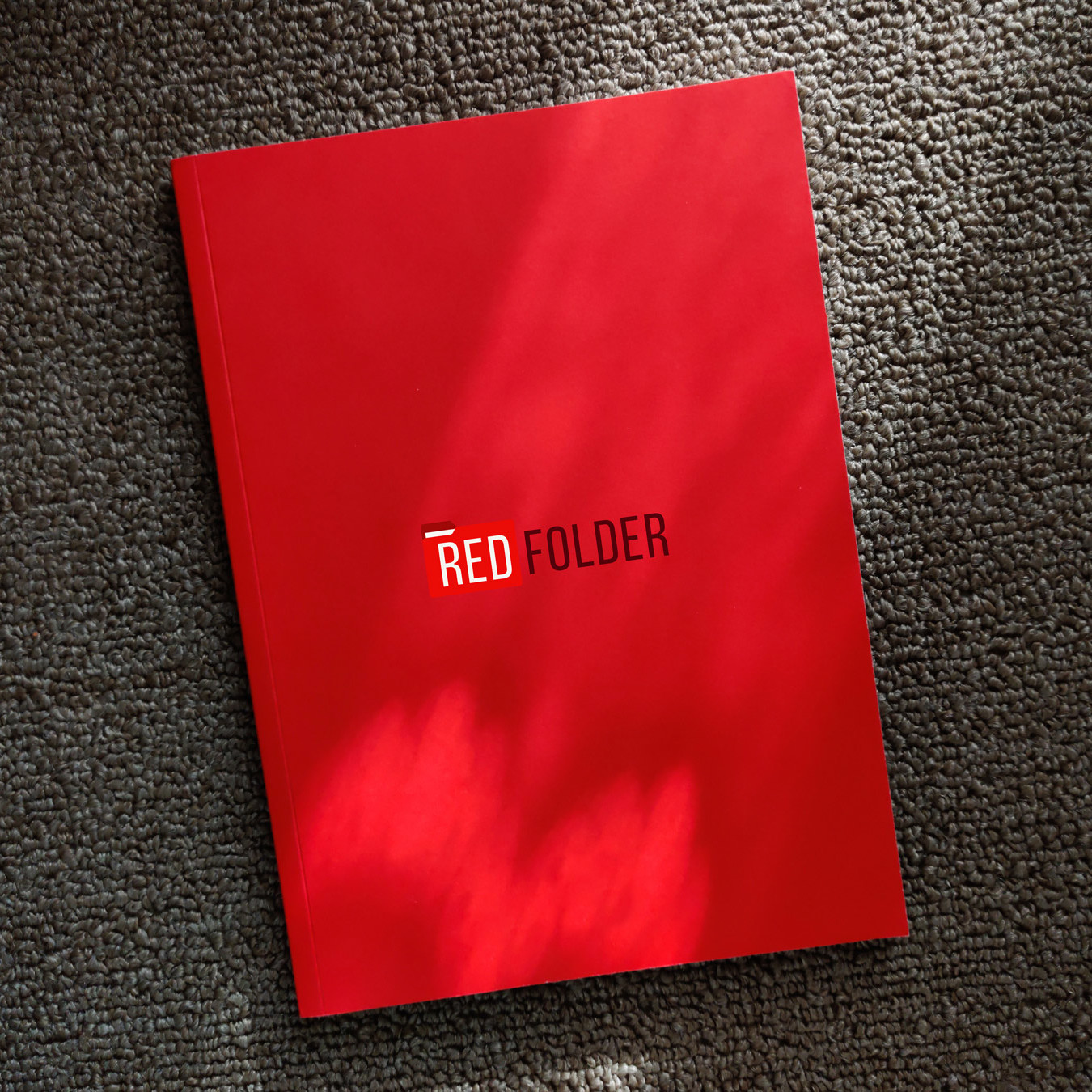 a red folder with the Redfolder logo on it
